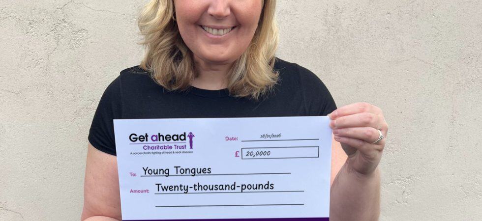 Barbara Fountain, CEO and founder of Young Tongues poses with a cheque donated by Get A-Head.