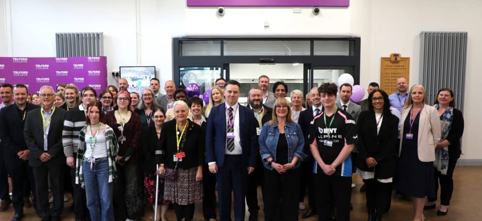 A crowd of students and staff from Telford College stand outside the newly opened library.